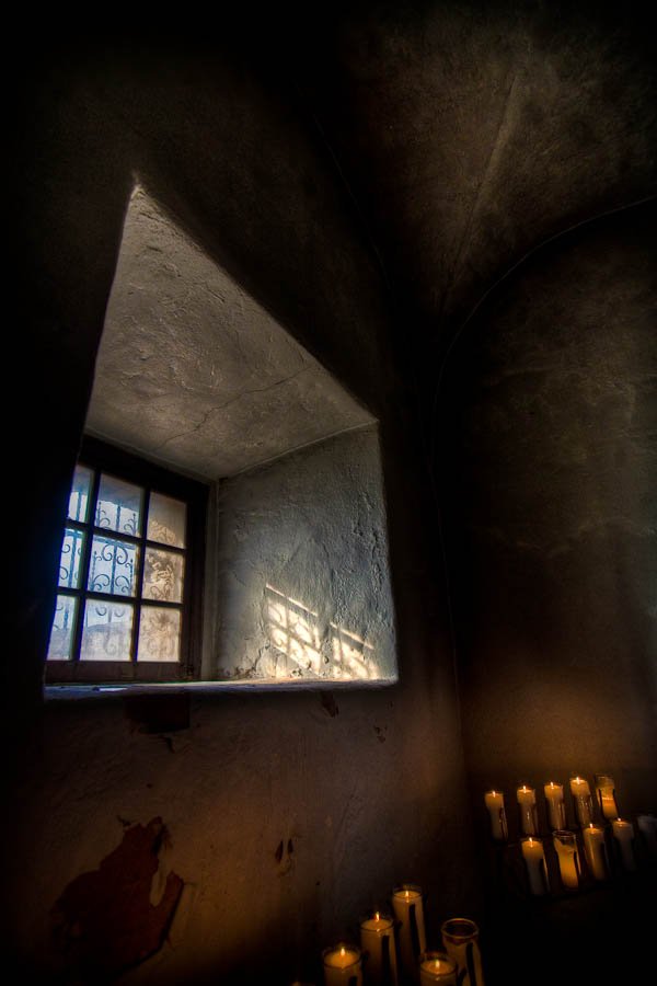 Presidio La Bahia chapel window with candles